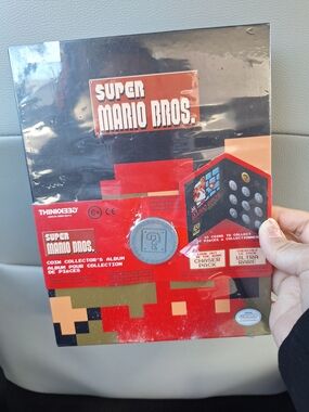 Super Mario Bros. Think Geek Nintendo Coin Holder Album & 1 Coin Pack *NEW*
